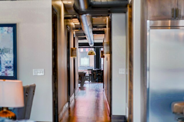 hallway with dark wood-type flooring