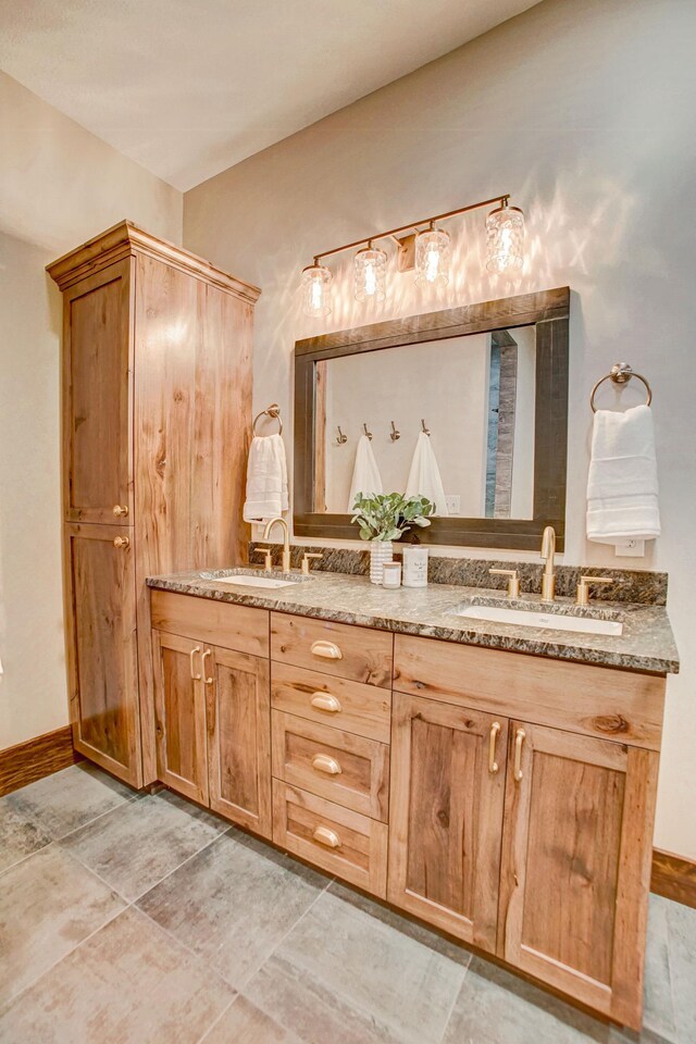 bathroom with tile patterned flooring and vanity