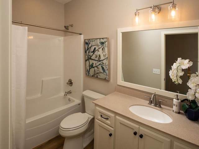 full bathroom featuring wood-type flooring, toilet, shower / tub combo, and vanity