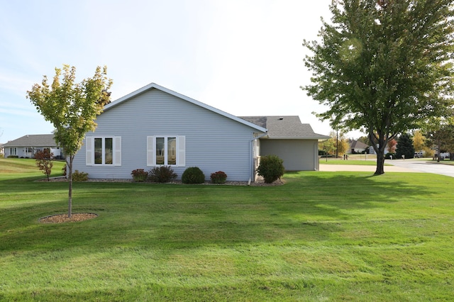 view of property exterior featuring a lawn