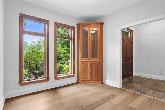 unfurnished room featuring light hardwood / wood-style floors