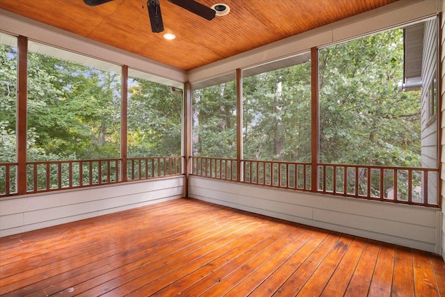 unfurnished sunroom featuring ceiling fan and wooden ceiling