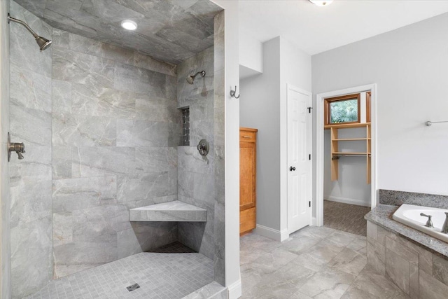 bathroom with shower with separate bathtub