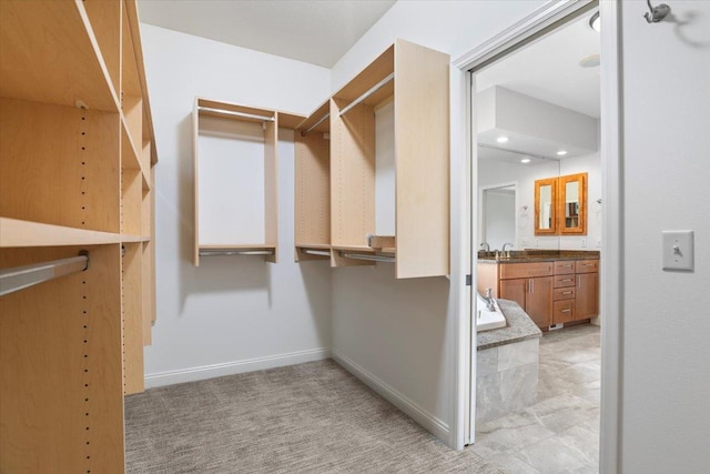 walk in closet featuring sink