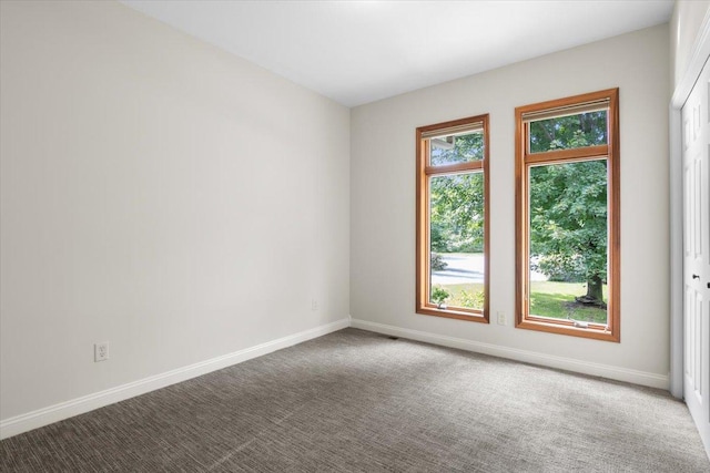 empty room featuring carpet flooring