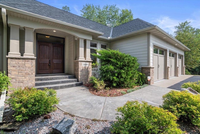 doorway to property featuring a garage