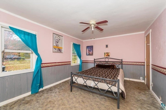 bedroom featuring ornamental molding, carpet, and ceiling fan