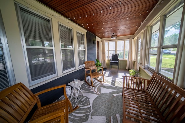 sunroom featuring wood ceiling