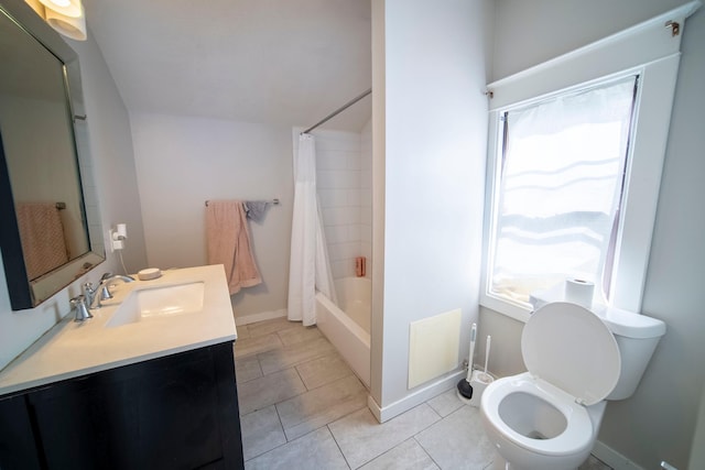 full bathroom with tile patterned flooring, vanity, toilet, and shower / bath combo with shower curtain