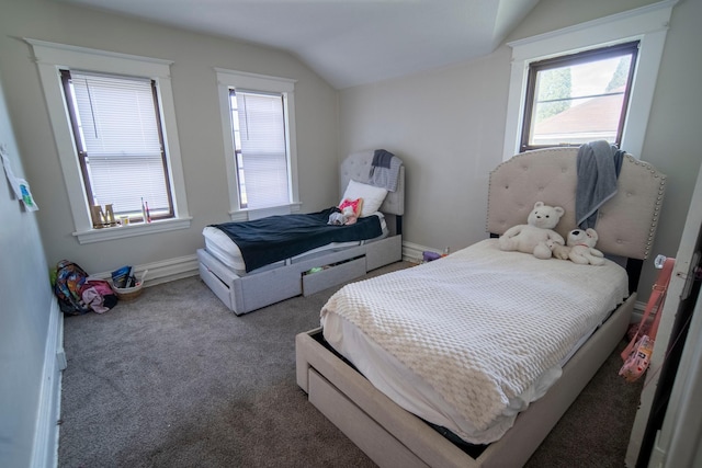 carpeted bedroom featuring lofted ceiling