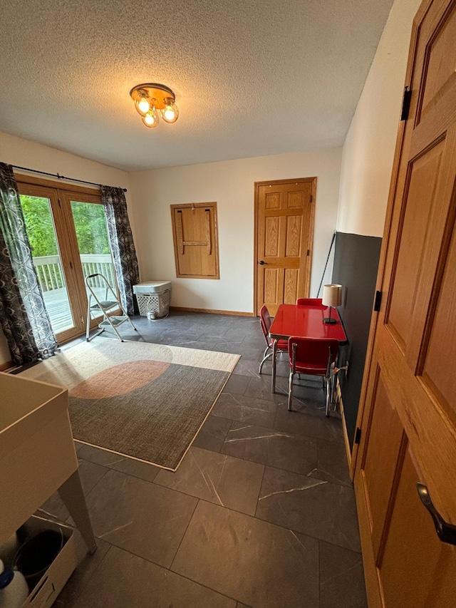 interior space featuring a textured ceiling