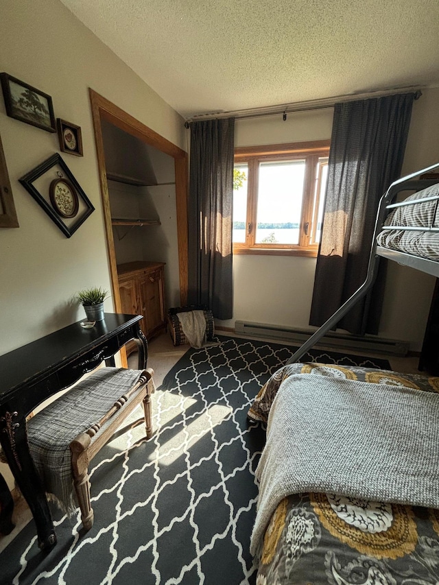 carpeted bedroom with a textured ceiling