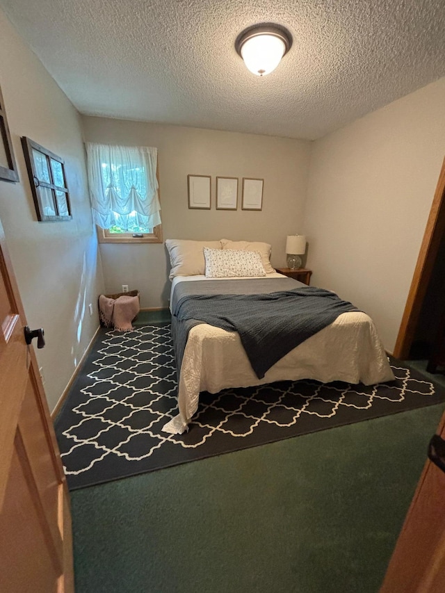 carpeted bedroom with a textured ceiling