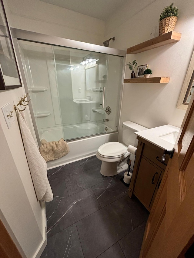 full bathroom featuring tile patterned flooring, vanity, toilet, and enclosed tub / shower combo
