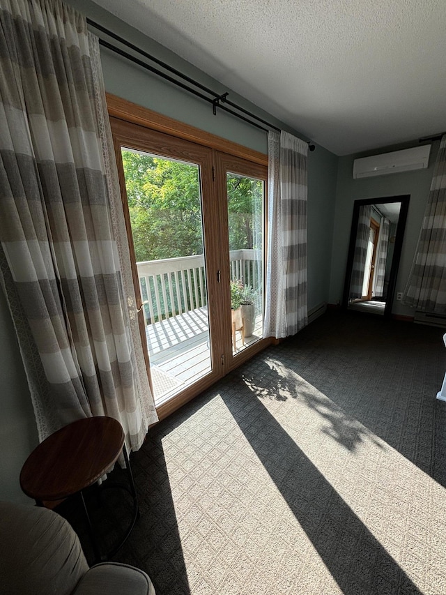 doorway with a wall mounted AC, a textured ceiling, and carpet floors