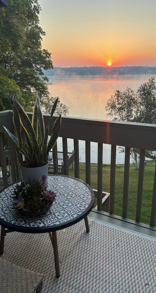 balcony at dusk with a water view