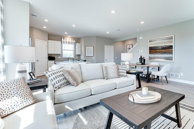 living room with light hardwood / wood-style flooring