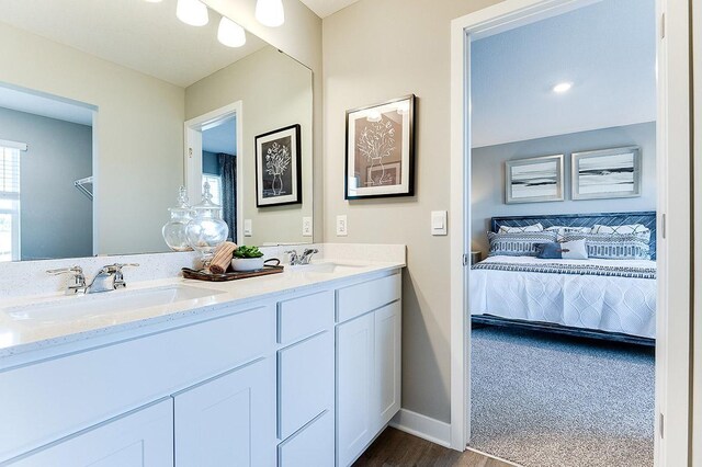 bathroom featuring vanity and hardwood / wood-style flooring