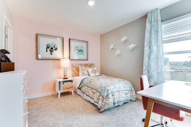 bedroom with light colored carpet