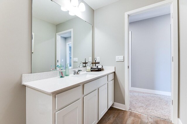 bathroom featuring vanity and hardwood / wood-style flooring