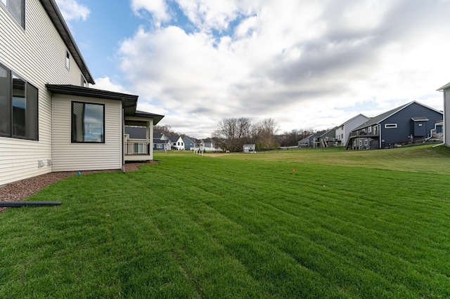 view of yard featuring a residential view