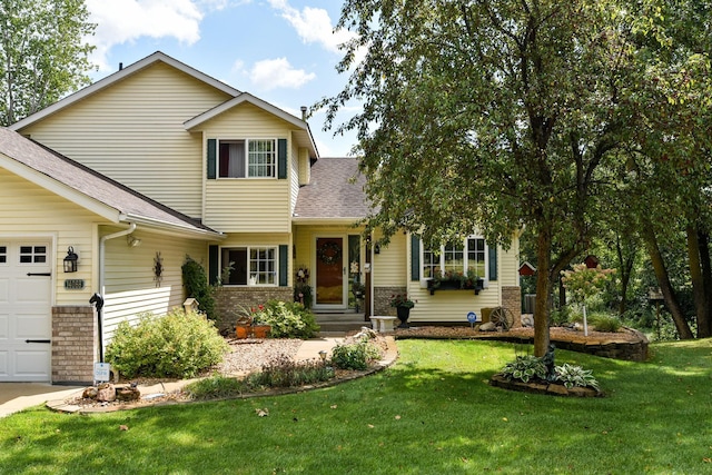 view of front of property with a garage and a front lawn