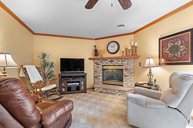 carpeted living room with crown molding, ceiling fan, and a brick fireplace