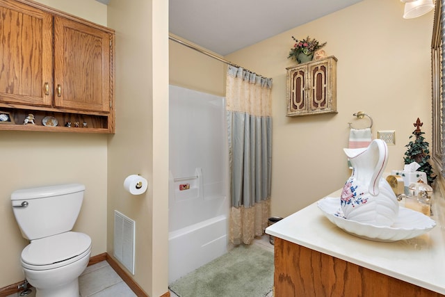 full bathroom featuring vanity, toilet, tile patterned floors, and shower / bathtub combination with curtain