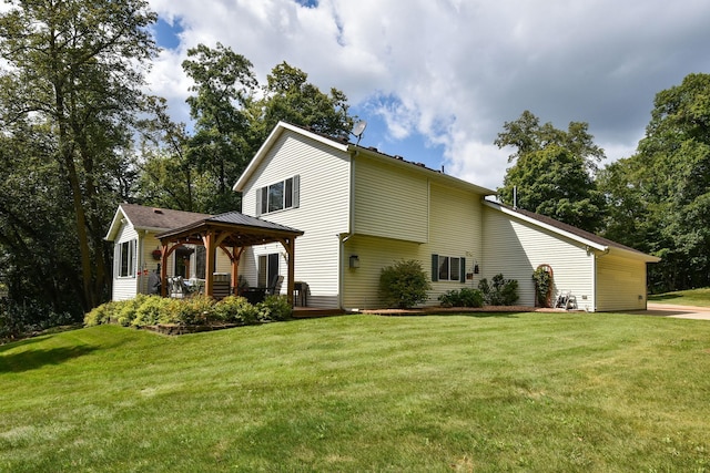 view of front of home with a front yard and a gazebo