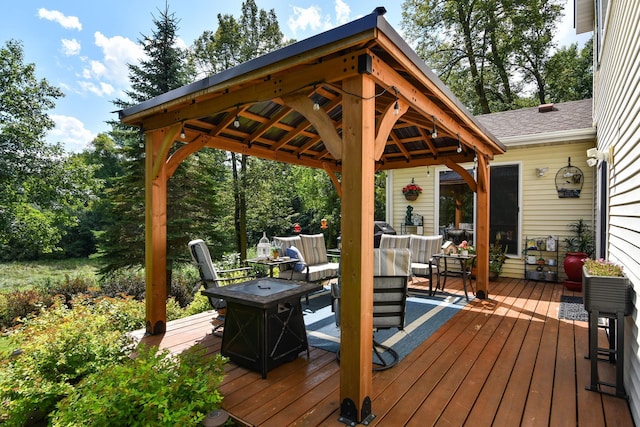 deck featuring a fire pit and a gazebo