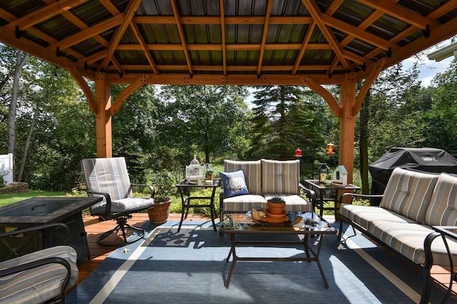 view of patio featuring a grill, a wooden deck, and a gazebo