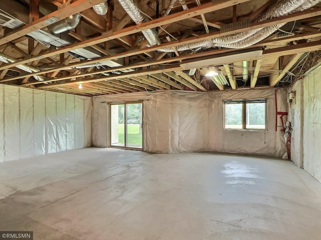 misc room featuring plenty of natural light and concrete flooring