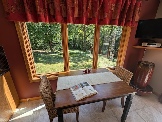 dining room featuring light tile patterned flooring