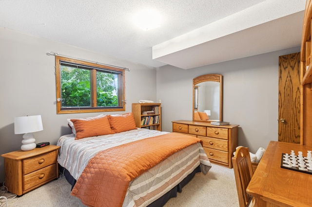 carpeted bedroom with a textured ceiling