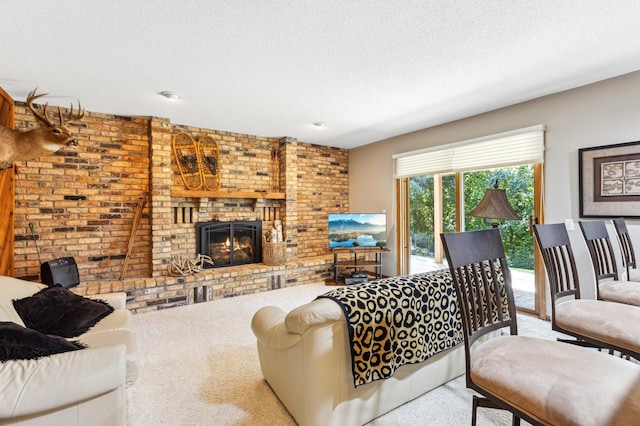 living room featuring a fireplace, light colored carpet, and a textured ceiling