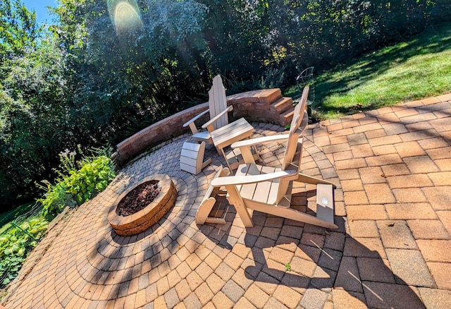 view of patio / terrace featuring an outdoor fire pit