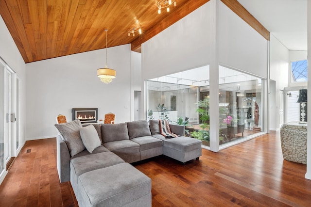 living room featuring wood ceiling, high vaulted ceiling, wood-type flooring, and beam ceiling