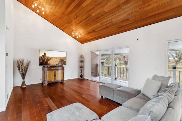 living room with a wealth of natural light, dark hardwood / wood-style flooring, and high vaulted ceiling