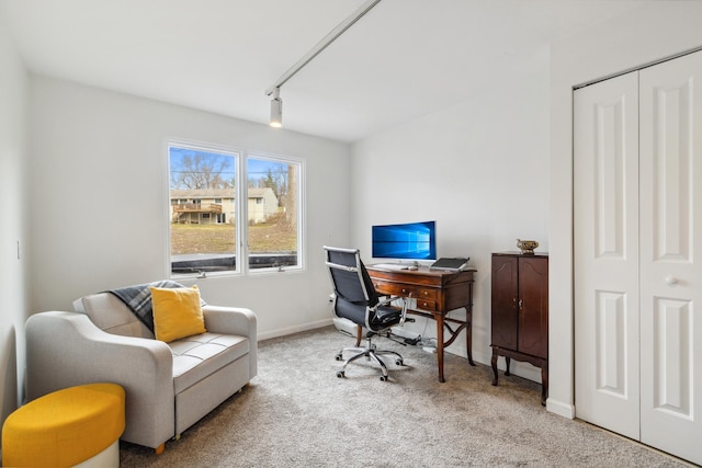 carpeted office space with rail lighting