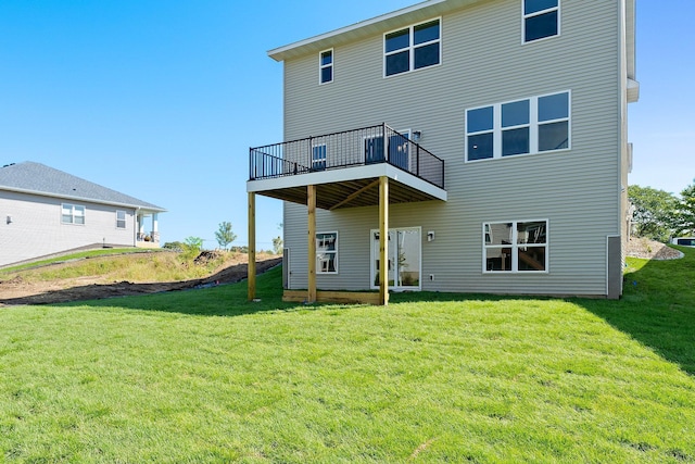 back of property featuring a lawn