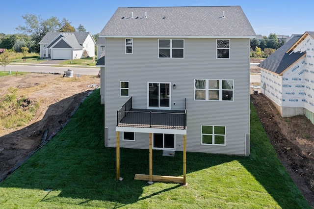 rear view of house with a yard