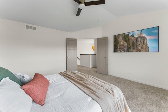 carpeted bedroom featuring ceiling fan and lofted ceiling