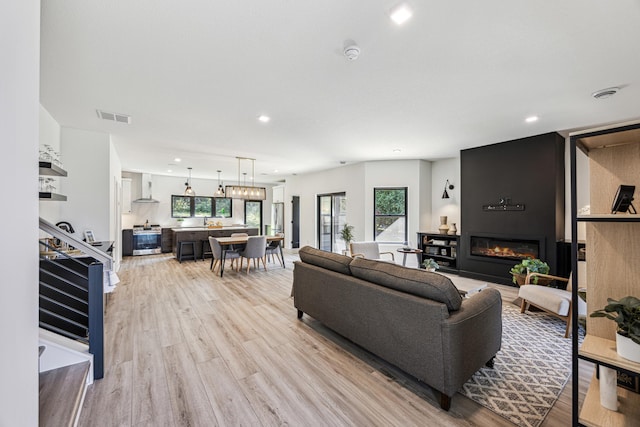 living room with light hardwood / wood-style flooring