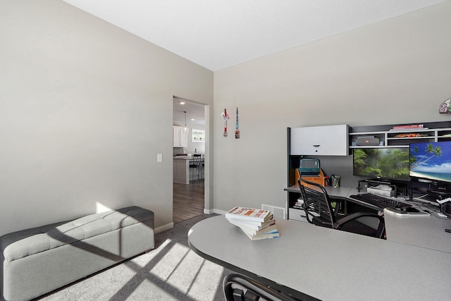 office area featuring visible vents, baseboards, and carpet