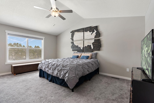 carpeted bedroom with visible vents, a textured ceiling, baseboards, and lofted ceiling