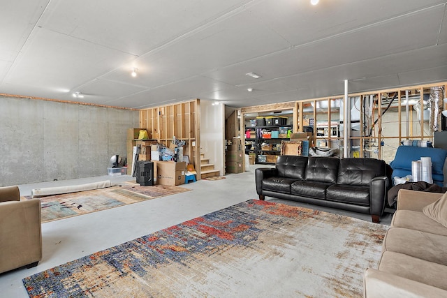 interior space featuring stairway and concrete floors