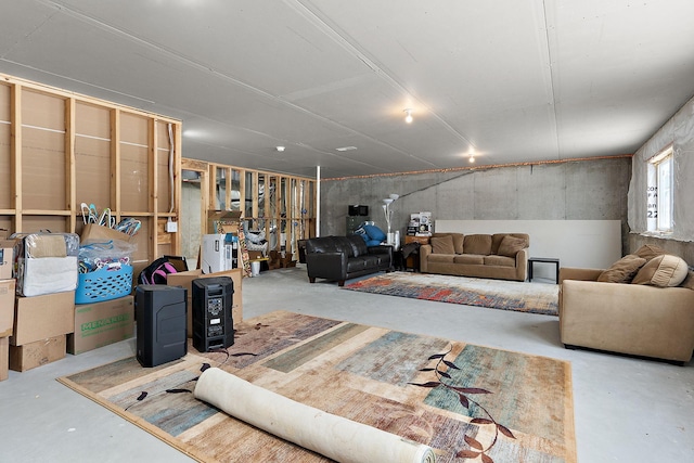 living area featuring concrete floors