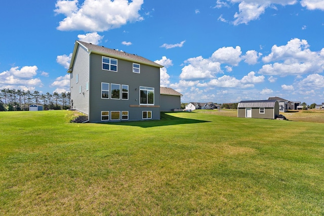 rear view of property with a storage shed, an outdoor structure, and a lawn