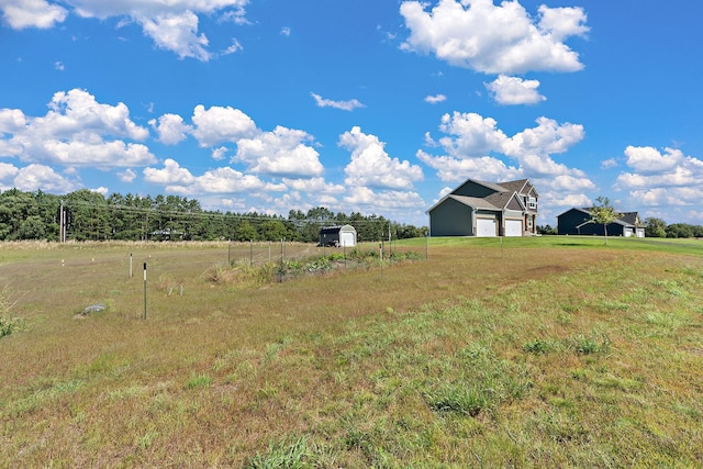 view of yard with a rural view