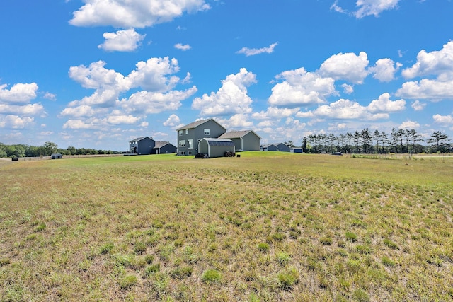 view of yard with a rural view